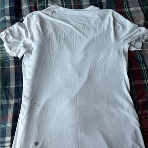 Lululemon white t shirt men size is XS. Barely used good condition.